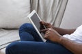 African-american man using digital tablet at home Royalty Free Stock Photo