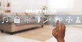 African American man using smart home automation control system, collage with icons on transparent screen. Panorama
