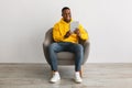 African American Man Using Tablet Browsing Internet On Gray Background Royalty Free Stock Photo