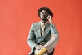 african american man in vintage eyeglasses talking on smartphone,