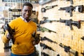 African-american man in weapon shop Royalty Free Stock Photo