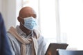 African American Man Wearing Mask in Audience Royalty Free Stock Photo