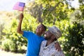 African American man wearing a military uniform holding his son Royalty Free Stock Photo