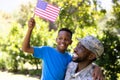 African American man wearing a military uniform holding his son Royalty Free Stock Photo
