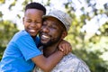 African American man wearing a military uniform holding his son Royalty Free Stock Photo