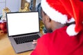 African american man wearing santa hat, using laptop with copyspace Royalty Free Stock Photo