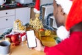 African american man wearing santa hat, using smartphone with copyspace Royalty Free Stock Photo