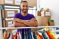 African american man wearing volunteer t shirt at donations stand happy face smiling with crossed arms looking at the camera Royalty Free Stock Photo