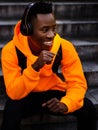 African-american man in wireless headphones listening music Royalty Free Stock Photo