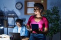 African american man and woman business workers using laptop and touchpad working at office Royalty Free Stock Photo