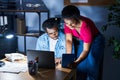 African american man and woman business workers using laptop and touchpad working at office Royalty Free Stock Photo