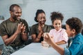 African american man and woman soldiers with their children