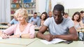 African American man and woman take exam