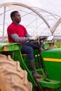 African american man working on garden tractor Royalty Free Stock Photo