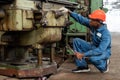 african american Mechanic repairing big heavy industry machine . black engineer maintenance machinery in Large Industrial Factory Royalty Free Stock Photo