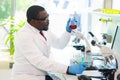 African-american medical doctor working in research lab. Science assistant making pharmaceutical experiments. Chemistry