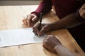 African-american man signing contract, customers couple put sign Royalty Free Stock Photo