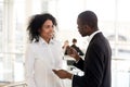 African american mentor ceo explaining helping mixed-race intern Royalty Free Stock Photo