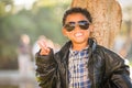 African American Mexican Boy Dressed Up in Sunglasses and Leather Jacket Royalty Free Stock Photo