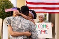 African american military soldier embracing woman and daughter at entrance Royalty Free Stock Photo