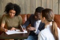 Black couple closing deal by signing contract in cafe Royalty Free Stock Photo