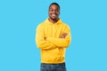 African American Millennial Guy Smiling Posing Crossing Hands, Blue Background Royalty Free Stock Photo