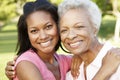 African American Mother And Adult Daughter Relaxing In Park Royalty Free Stock Photo