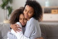 African American mother and daughter embracing, enjoying moment together Royalty Free Stock Photo