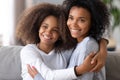 African American mother and daughter hugging, posing for family photo Royalty Free Stock Photo