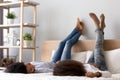 African American mother and daughter lying on bed and talking Royalty Free Stock Photo