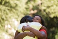 African American mother hugghing her daughter. Royalty Free Stock Photo