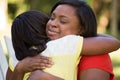 African American mother hugghing her daughter. Royalty Free Stock Photo