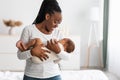 African American mother singing lullaby for infant to sleep Royalty Free Stock Photo