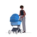 African american mother walking with newborn baby in stroller motherhood concept full length Royalty Free Stock Photo