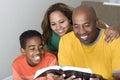 African American multicultural family reading The Bible. Royalty Free Stock Photo