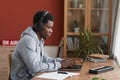 African-American Musician Using Laptop