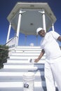 African-American in Natchez, MS paints Gazebo with new coat of white paint