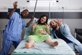 African american nurse and couple expecting child Royalty Free Stock Photo