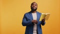 Person presenting literature novel, reciting from pages, studio background