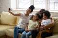 African American parent with two kids taking selfie. Royalty Free Stock Photo
