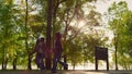 African american parents holding hands walking run green park walkway together. Royalty Free Stock Photo