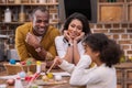 African american parents looking how daughter painting easter eggs Royalty Free Stock Photo