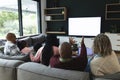 African american parents, son, daughter and grandparents watching tv with copy space, slow motion