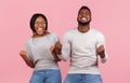 African american partners rejoice success, clench fists and exclaim