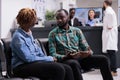 African american people talking in waiting area lobby Royalty Free Stock Photo