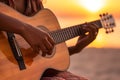 African american person\'s hands playing acoustic guitar on sandy beach at sunset time. Playing music concept, neural network