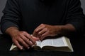 African American Person Studying the Bible Sitting at Desk Royalty Free Stock Photo