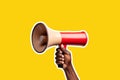 African american persons hand holding an announcement megaphone. Graphic cut out style