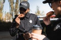 African american policeman with paper cup Royalty Free Stock Photo