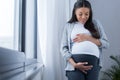 african american pregnant woman looking at her Royalty Free Stock Photo